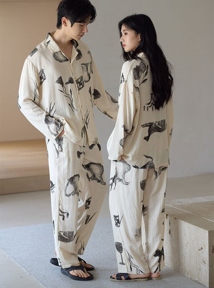 Couple in matching Ink Still Life Bamboo Pajama Sets in a relaxed indoor lifestyle photo