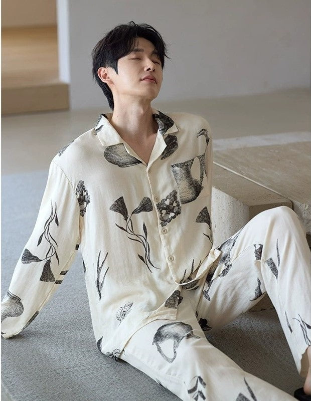 Man in the Ink Still Life Bamboo Pajama Set sitting indoors in a soft neutral setting